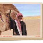 Bedouin and camel in Wadi Rum, Jordan : NPR